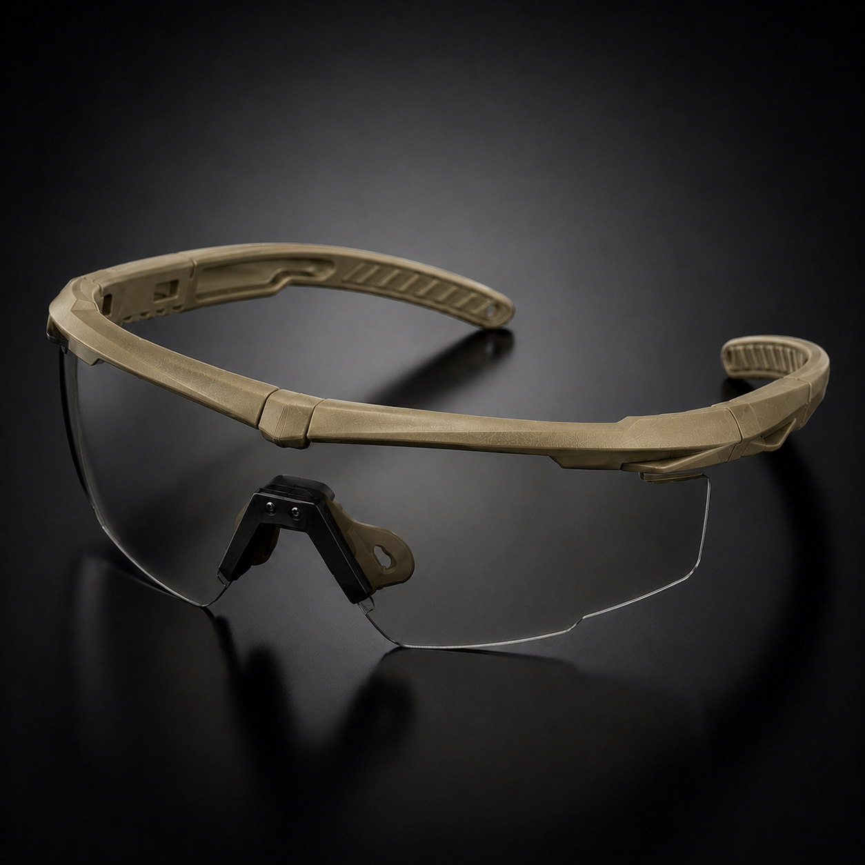Khaki tactical goggles, 45-degree angled view, showing frame, transparent lenses, adjustable nose pad, protective eyewear for outdoor, CS, and field combat.